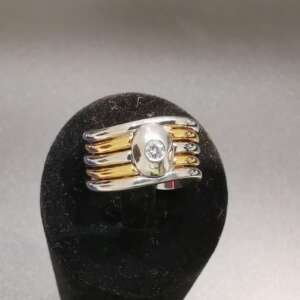Anillo de dos oros 18 k con diamante central