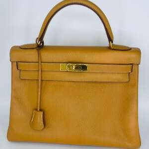 Bolso Hermès Kelly de cuero camel auténtico y elegante