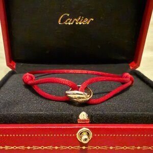 Pulsera Cartier Trinity 3 oros 18k con cordón rojo y caja
