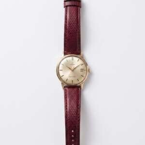 Reloj Omega vintage de oro automático con correa de cuero